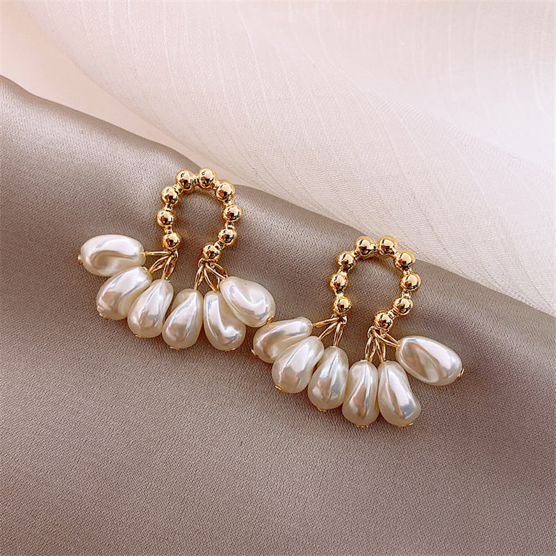 Boucles d'oreilles dorées avec perles